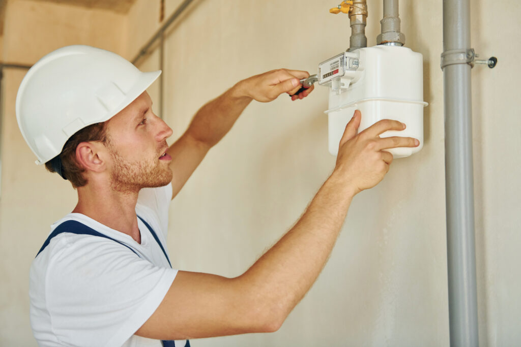 Plumber providing water heater repair plumbing services